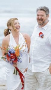 bride and groom laughing together during relaxed wedding reception
